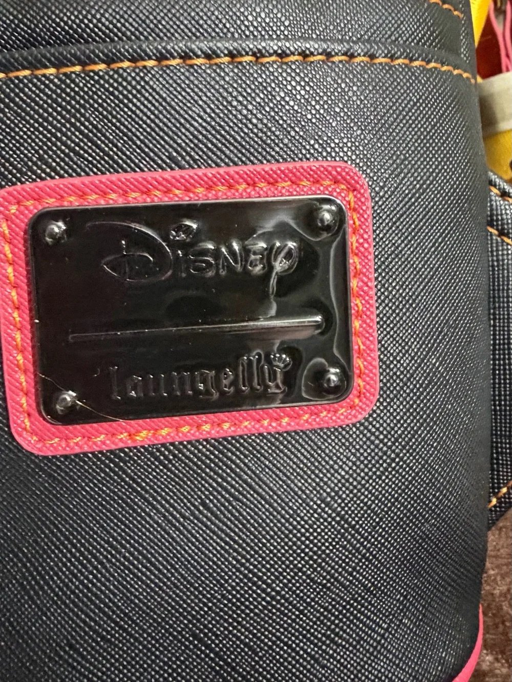 Loungefly Black Mini Backpack with Pink Trim and Yellow Stitching